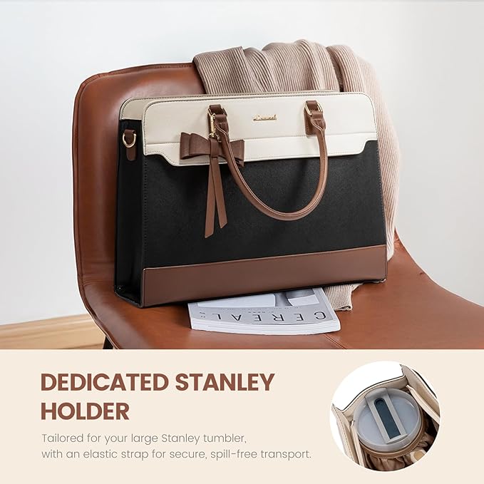 Elegant beige leather handbag with gold hardware on a marble surface